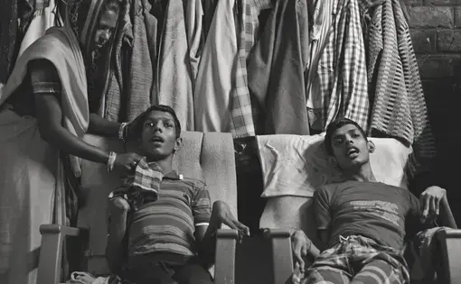 Living victims: Vikas Yadav, 19, and Aman Yadav, 17, brothers, have muscular dystrophy and are being cared for by their mother at their home. Affected by toxic waste which seeped into the groundwater, they will live short, painful lives. Image by Rohit Jain. India, 2018.