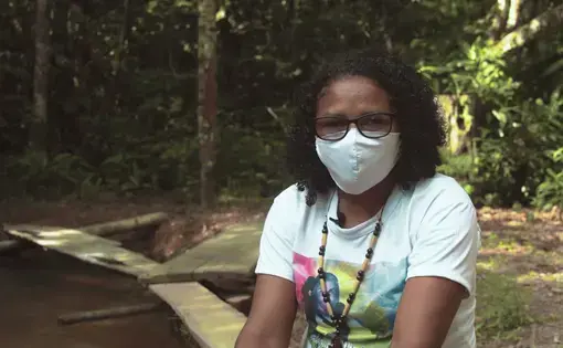 Woman wearing a mask.