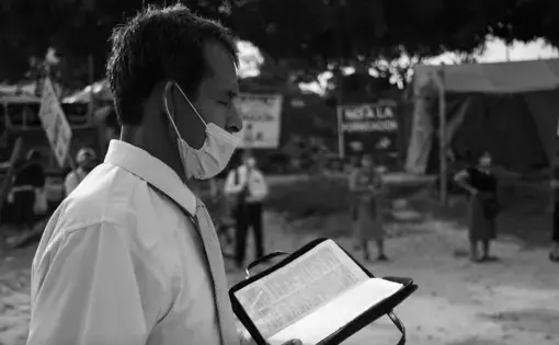 An evangelist preacher giving mass in the port of the city of Pucallpa, Peru.