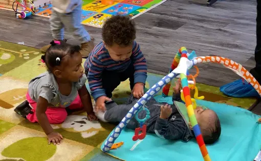 Children play indoors.