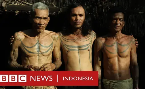 three traditionally tattooed men