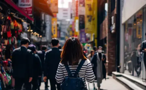 Young asian woman traveler traveling and shopping in Myeongdong street market at Seoul, South Korea.