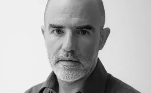 A bald man with a shirt.