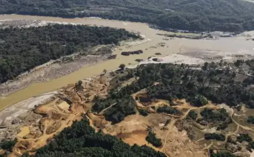 An aerial overview of a mining field and deforested areas in Myanmar.