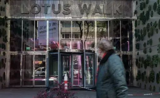 Man walking in front of store