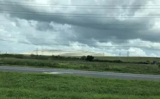 phosphogypsum stack rises in the distanc
