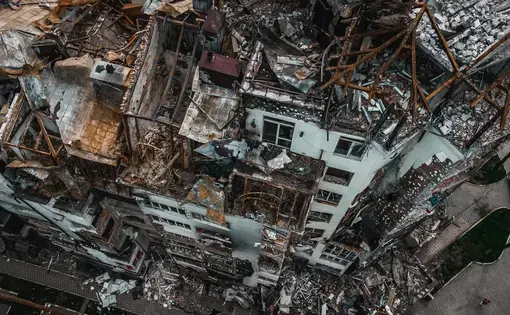 an aerial shot of ruined buildings in war-torn Ukraine