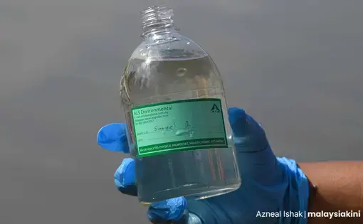 A bottle of sample water.