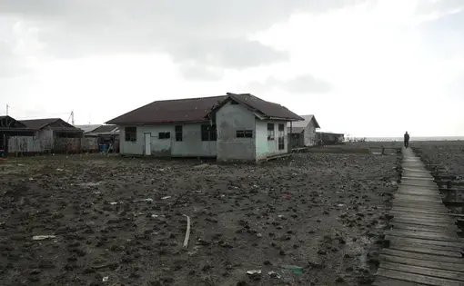 A house built on a barren piece of land.