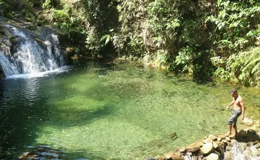 A man stands atop the spring.