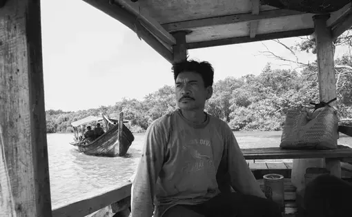 A man sitting in a boat.