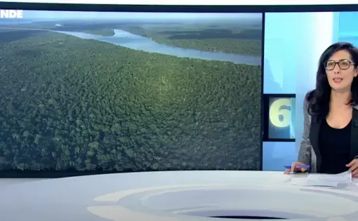 a person presents a photo of the amazon