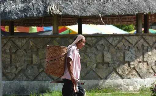 A man walks on the road.