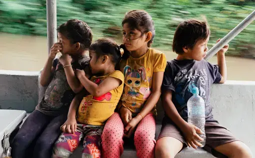 Children from the Mukucham family in Wichimi ride on the Wampi.