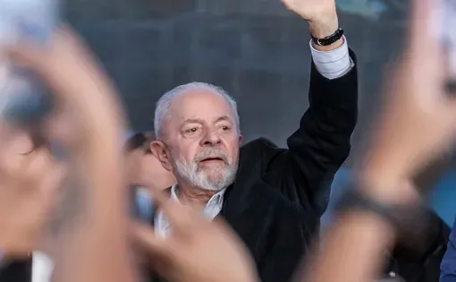 Current Brazilian President Lula da Silva waves to a crowd