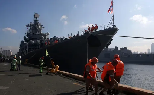 Seafarers prepare to dock a Russian missile cruiser in Metro Manila, Philippines