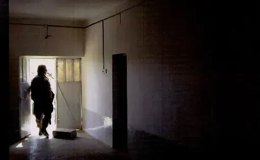 a soldier exits a room in Iraq