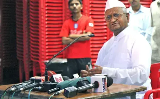 Anna Hazare speaks with supporters in Ralegan Siddhi in India.