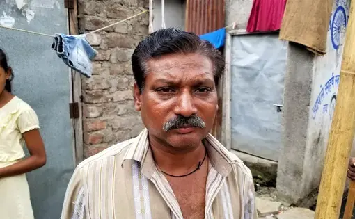 Dalit sewage cleaner, who is on the lowest rungs of so-called "untouchables." Image by Phillip Martin/WGBH News. India, 2019.