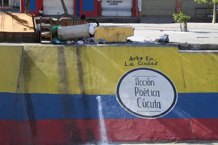 A homeless man has made a mural his place of rest in Cucuta.&nbsp;Image by Mariana Rivas. Colombia, 2019.