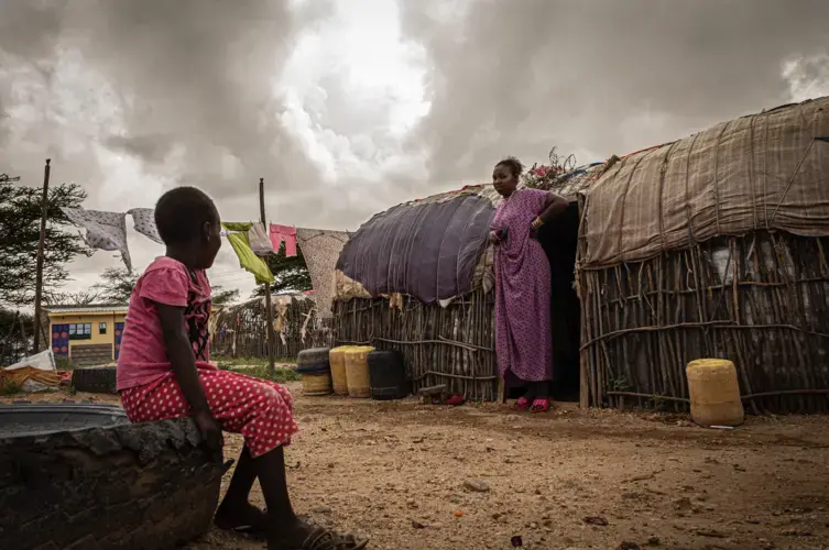 Vicky, 18, with her sister at their family home in Laisamis, Kenya.&nbsp;Image by Will Swanson. Kenya, 2020.