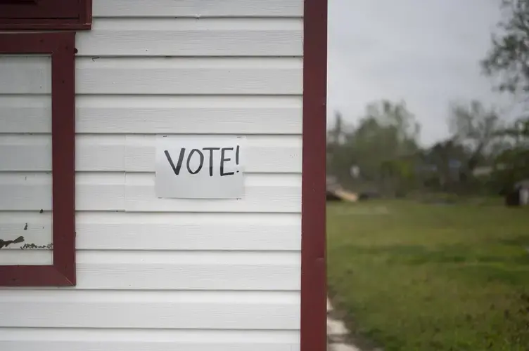 Signs official and handmade encouraging voter turnout plaster the streets of Lake Charles amidst the destruction from back-to-back Hurricanes Laura and Delta and a slow recovery due to COVID-19. Image&nbsp;by Katie Sikora. United States, 2020.