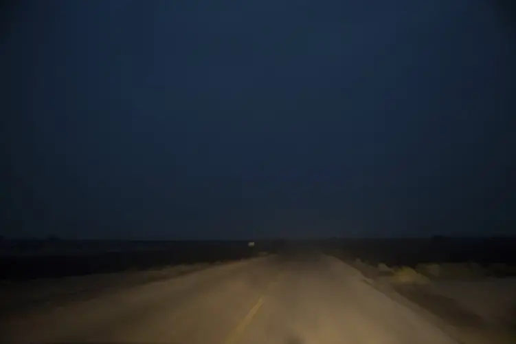 A road is shown early in the morning. Image by Nariman El-Mofty. Yemen, 2019.