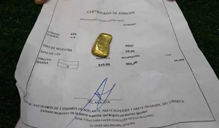 A small lump of processed gold with its certification papers. The trouble with the fabulous claims made for the Arco Minero and its mineral wealth is that those claims have not been certified, so are vastly uncertain and influenced by speculation. The natural wonders and biodiversity found there are, however, a matter of fact. Image by Bram Ebus. Venezuela, 2017.<br />
