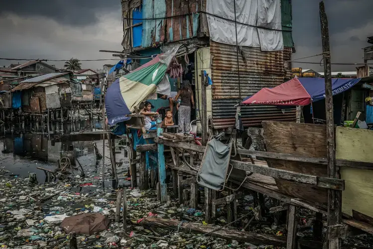 John ‘Toto’ Dela Cruz, 16, was another victim of the&nbsp;war on drugs. Masked assassins pulled him out of this house in Navotas, which he shared with his 15-year-old partner, Jasmin Dorana, before shooting him four times in the head and chest on the front porch. Image by James Whitlow Delano. Philippines, 2017.