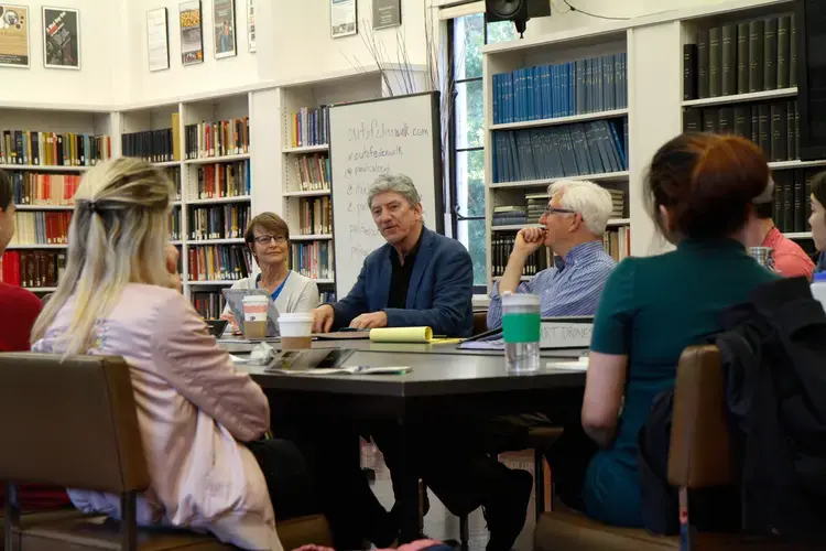 (Left to right) Cynthia Gorney, Don Belt, and Tim McGirk speak to McGirk's class about international journalism at University of California, Berkeley. Image by Lauren Shepherd. United States, 2017.