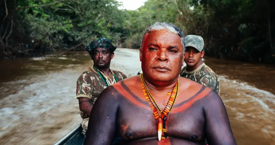 Claudio da Silva and the Guajajara Guardians of the Forest ride up the Caru River to investigate a report of illegal cutting on Guajajara land. Image by Sam Eaton. Brazil, 2018.