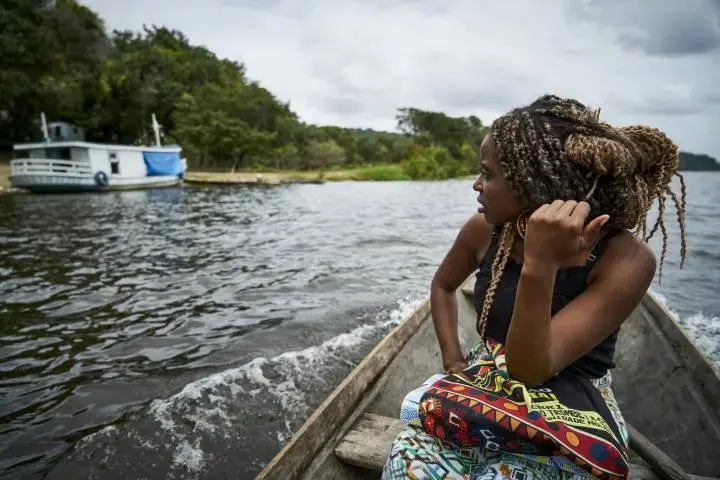 Drica on her way to the community school where she's a teacher. Image by Pablo Albarenga. Brazil, 2019. 