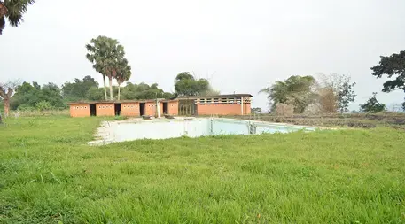 The pool at Yangambi sits empty, like many of the buildings at the site. Image by Daniel Grossman. Democratic Republic of the Congo, 2017.