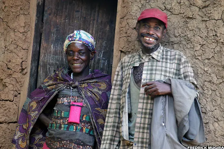 Jackson Kyomukama, chairperson of Karehe Batwa group in Bwindi, with his daughter-in-law. Image by Fredrick Mugira. Uganda, 2020. 