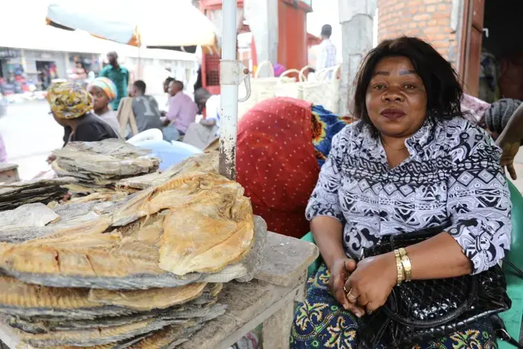 Ngongo Amunazo, a 40-year-old fish trader in Goma, Congo, is worried about the economic impact of the measures taken to stem the coronavirus’ spread. Image by Peter Yeung / LA Times. Congo, 2020.