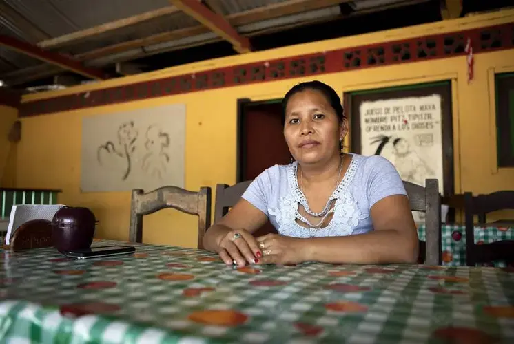 “A year ago, we didn't have enough space for everyone,” says Marixa Garcia Ramos, a cook at the Cepi Pollo restaurant and hotel. Now she worries the restaurant will have to shut down. Image by Miguel Gutierrez Jr. Guatemala, 2019.