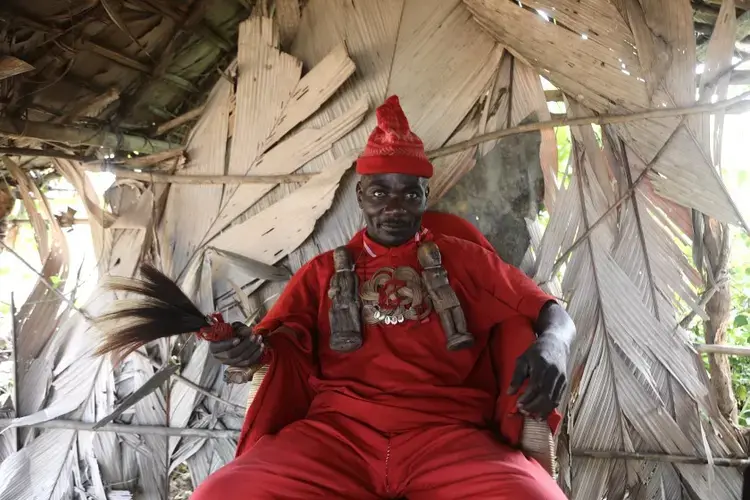 Village chiefs in the region wear red as a symbol of blood and power. Image by Peter Yeung/The Los Angeles Times. Congo, 2020.