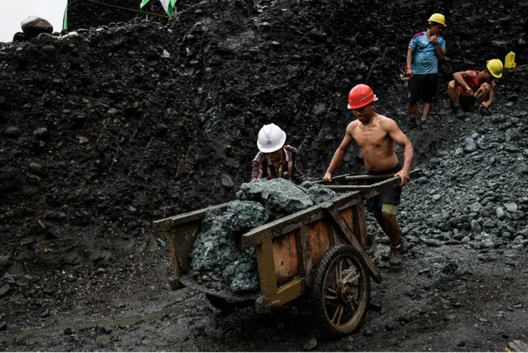 A team of freelance miners cart away stones from a jade mine in Hpakant on July 17. Image by Hkun Lat. Myanmar, 2020.