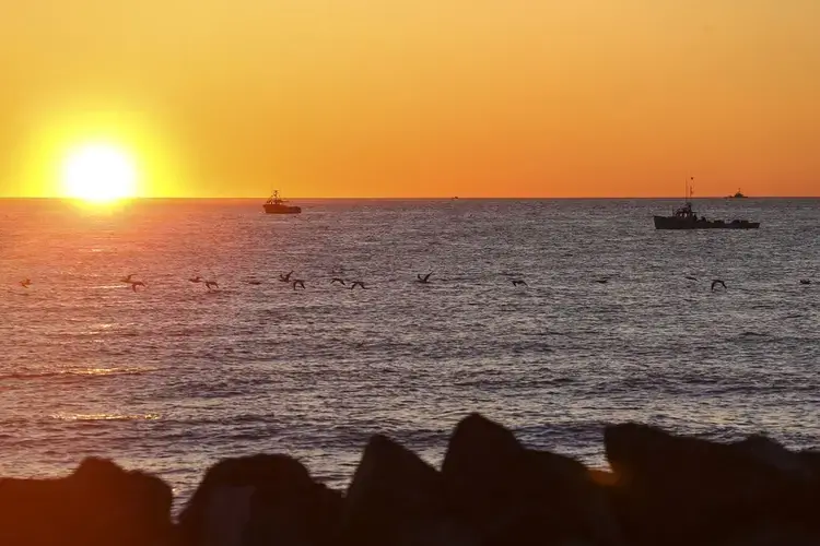 Lobstermen fished off of Miscou Island at sunrise.&nbsp;Image by Nathan Klima. Canada, 2019.
