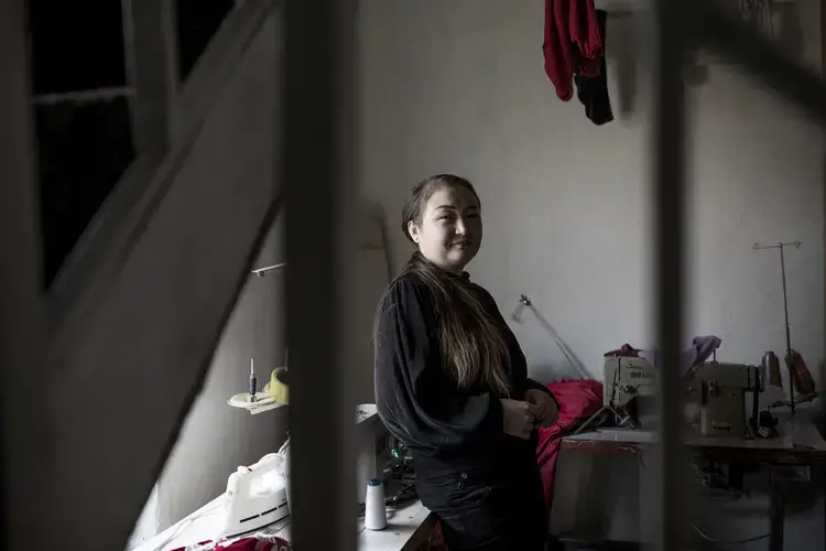Dina Nurdybai in her sewing workshop at her home in Almaty, Kazakhstan, on February 25, 2020. Image by Ekaterina Anchevskaya /&nbsp;BuzzFeed News. Kazakhstan, 2020.