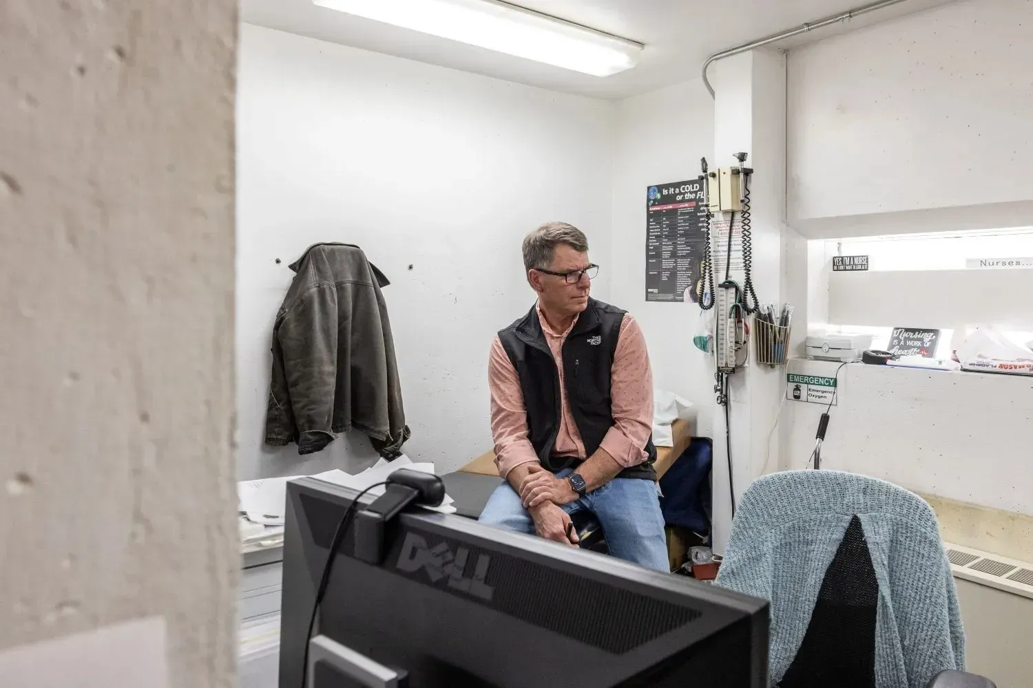 Physician assistant Greg Ellis sits in the Franklin County Detention Center’s closet-like medical space in Farmington in March.