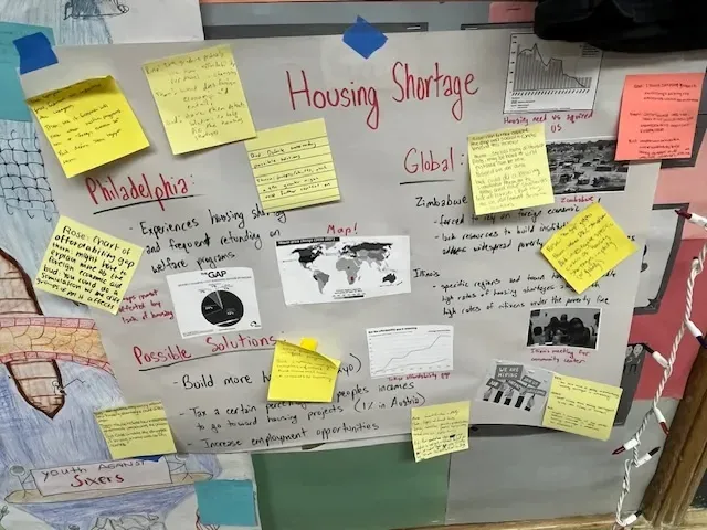 student handwritten poster with sticky notes