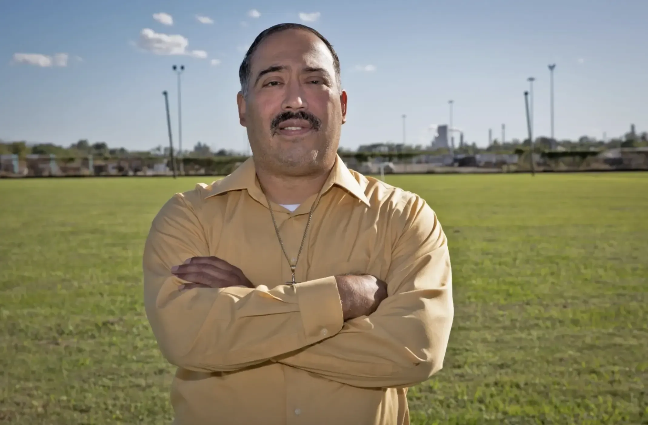 a man stands in smokestacks 