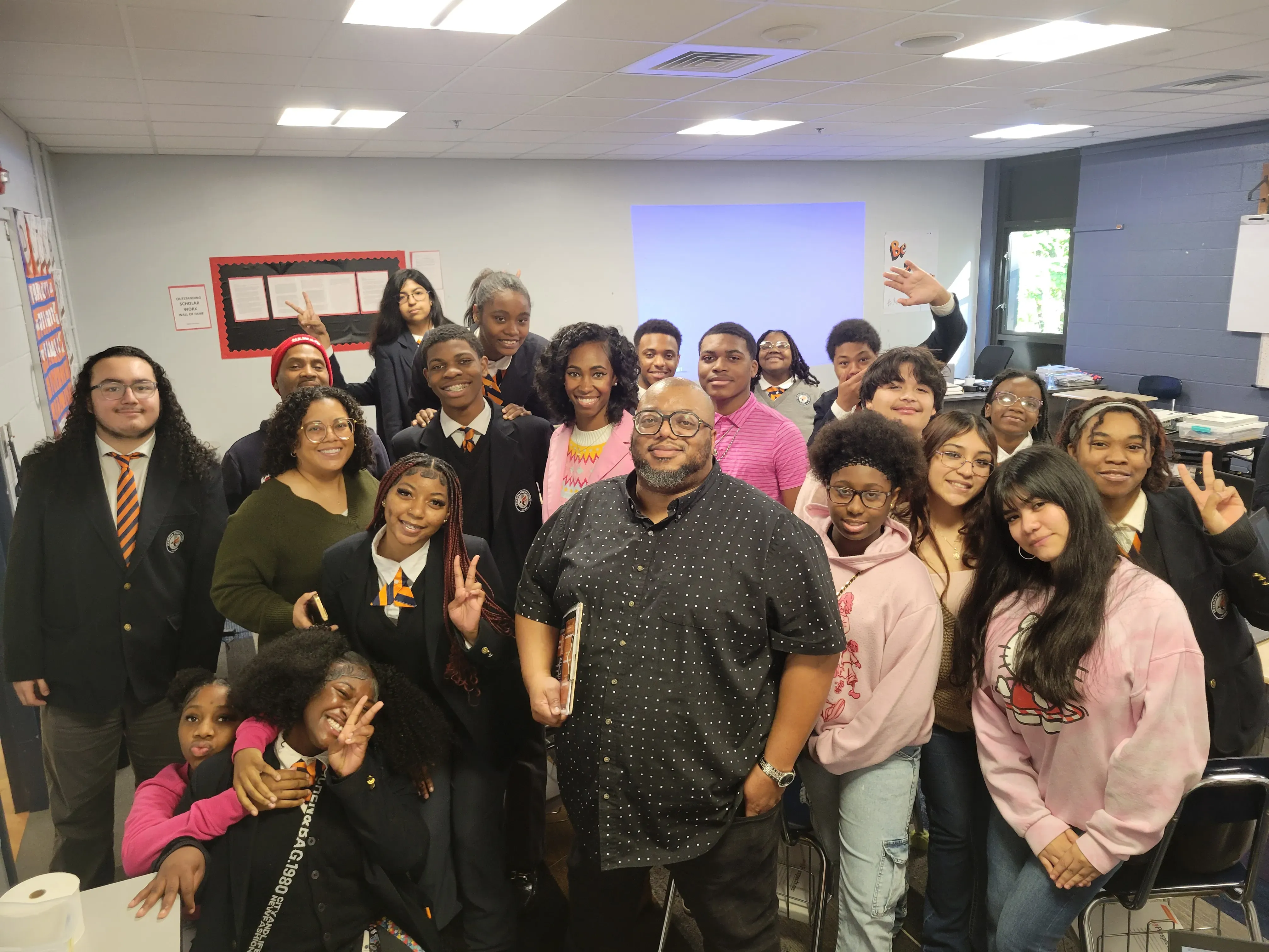 Timothy Moore and his students pose for a photo with reporters from WREG.