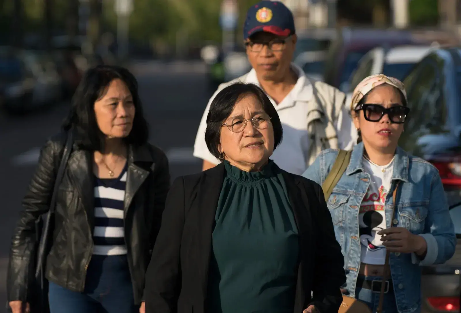 Cora Espanto, accompanied by fellow Filipino migrants, walks to a tram stop in The Hague, Netherlands, heading home after participating in a community health outreach event at Het Wereldhuis