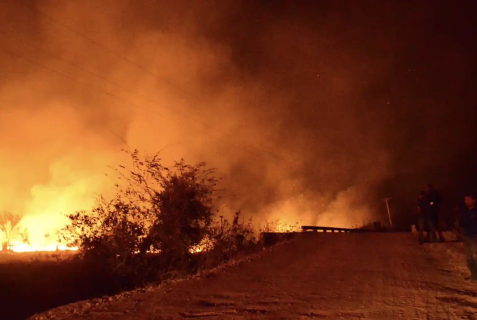 A fire on the side of the highway