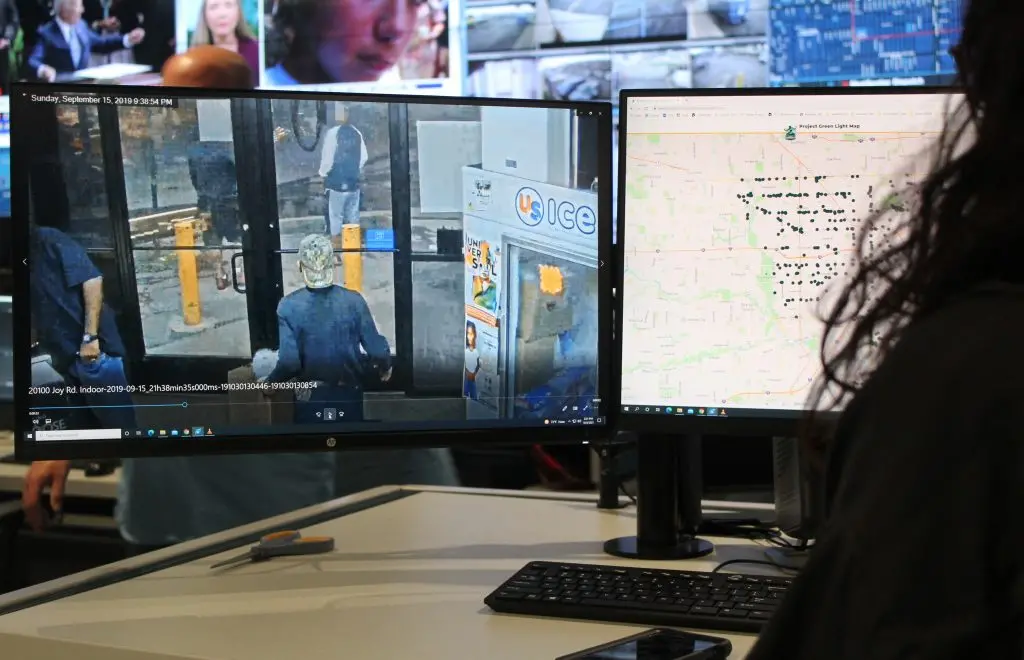Tia Tsakos reviews archival security footage at Detroit’s Real Time Crime Center. 
