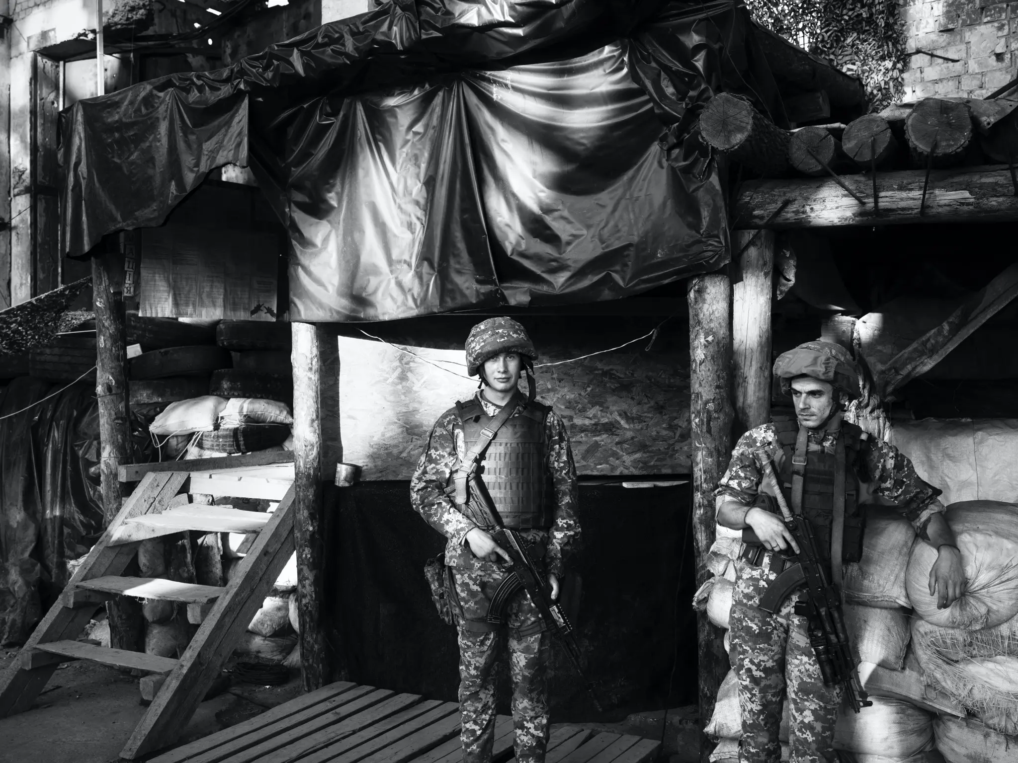 Soldiers lean on materials 