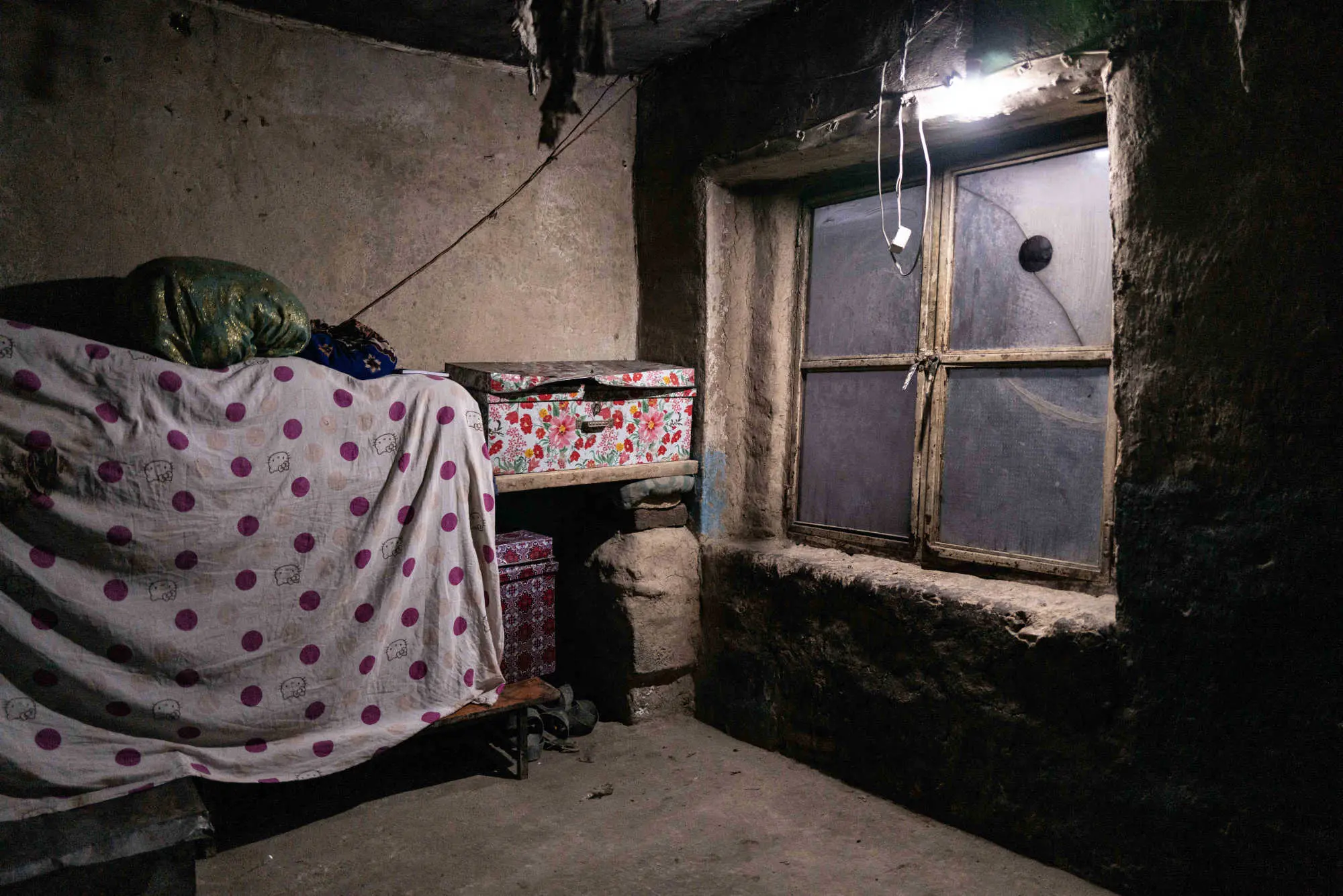 A woman lays on her bed