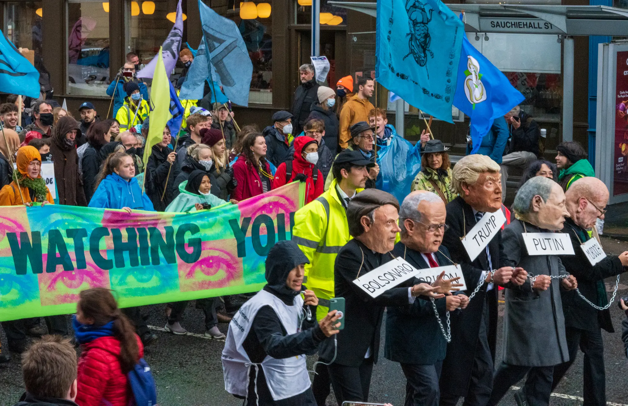 protestors dressed as world leaders